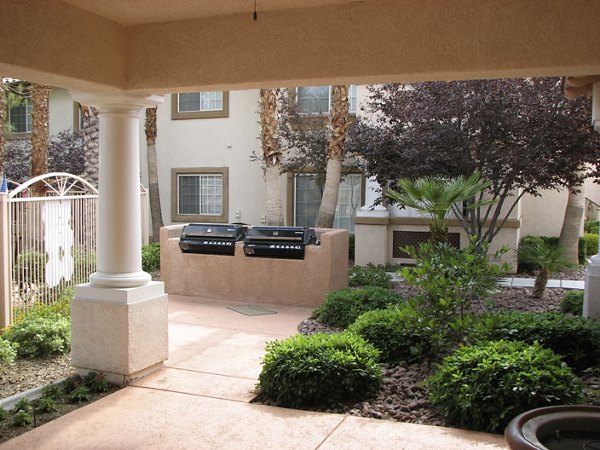 Outdoor grill area with modern seating at Destinations Pueblo Apartments, ideal for social gatherings and dining al fresco
