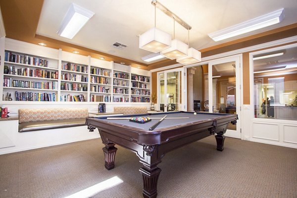 Game room with billiards and seating at Destinations Spring Valley Apartments