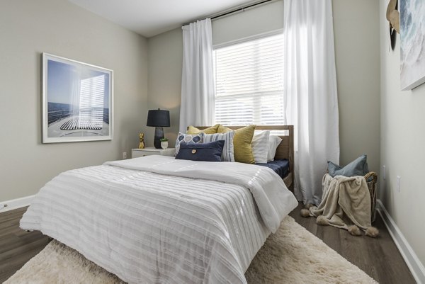 Cozy bedroom with elegant decor in Avana Lake Norman Apartments