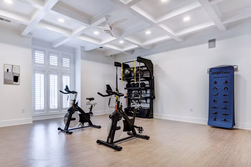 Modern yoga/spin studio with floor-to-ceiling mirrors at Avana Lake Norman Apartments