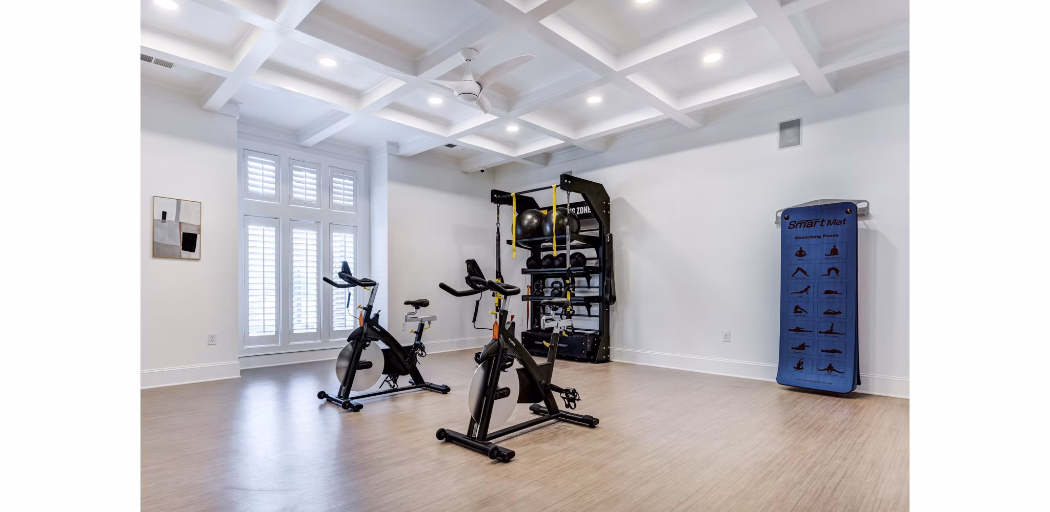 Modern yoga/spin studio with floor-to-ceiling mirrors at Avana Lake Norman Apartments