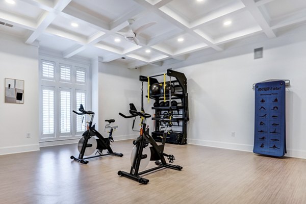 Modern yoga/spin studio with floor-to-ceiling mirrors at Avana Lake Norman Apartments