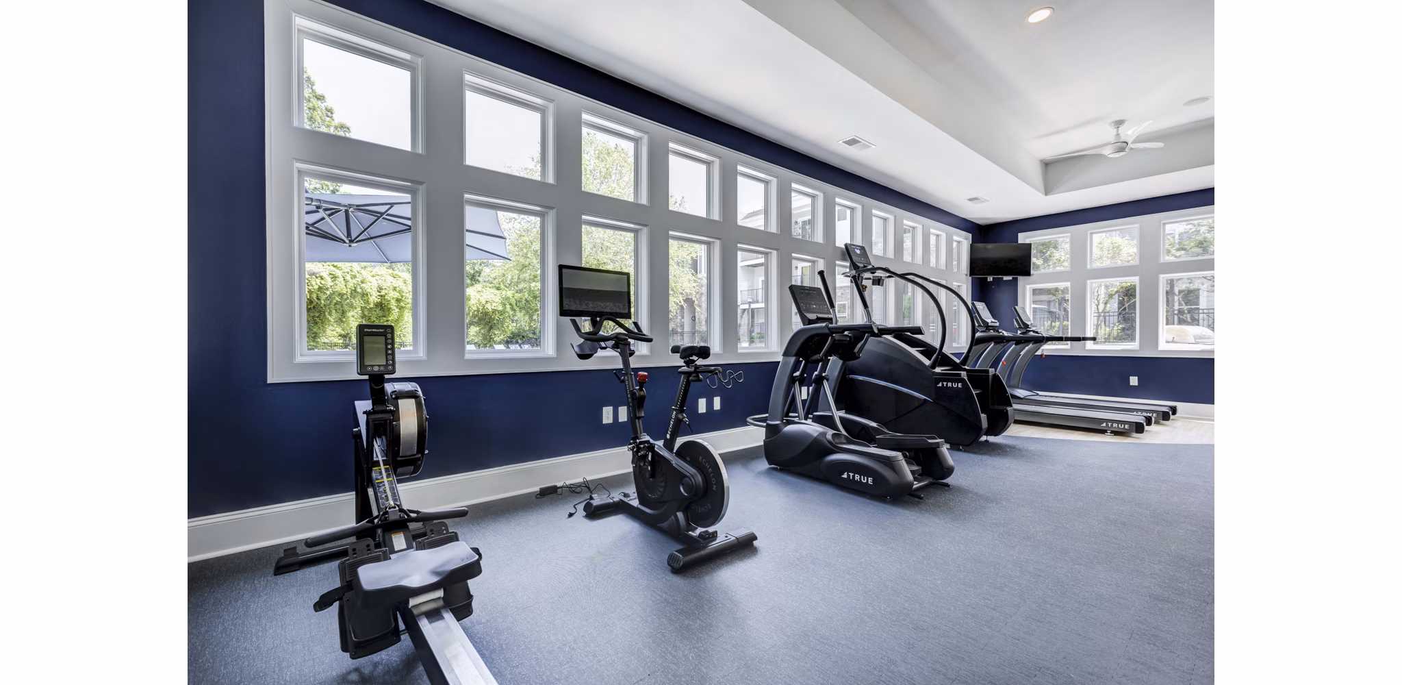 Spacious fitness center with modern equipment at Avana Lake Norman Apartments