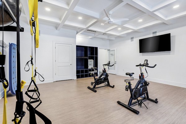 Bright yoga and spin studio at Avana Lake Norman Apartments, featuring mirrored walls and ample natural light for fitness enthusiasts