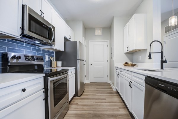 Modern kitchen with stainless steel appliances at Avana Lake Norman Apartments