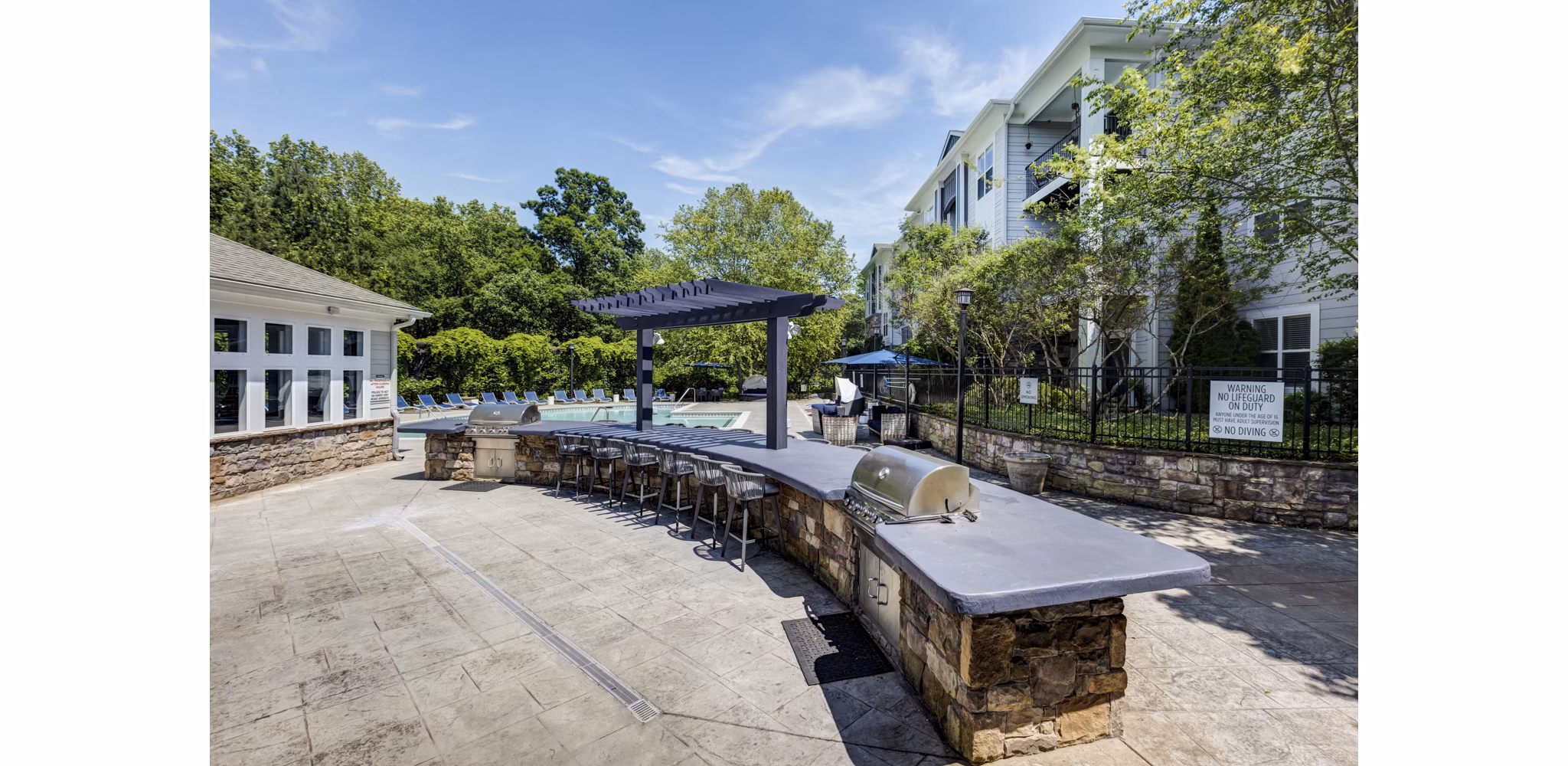 Outdoor BBQ grill area at Avana Lake Norman Apartments, perfect for social gatherings and relaxation