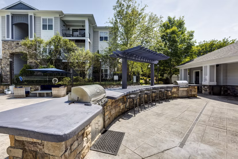 Grill area with modern seating at Avana Lake Norman Apartments