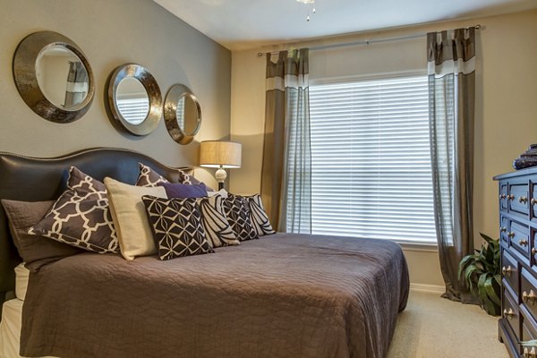 Bedroom with modern decor and ample natural light in Estates at Memorial Heights Apartments