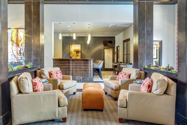 Clubhouse lounge featuring modern decor and ample seating at Estates at Memorial Heights Apartments in Houston