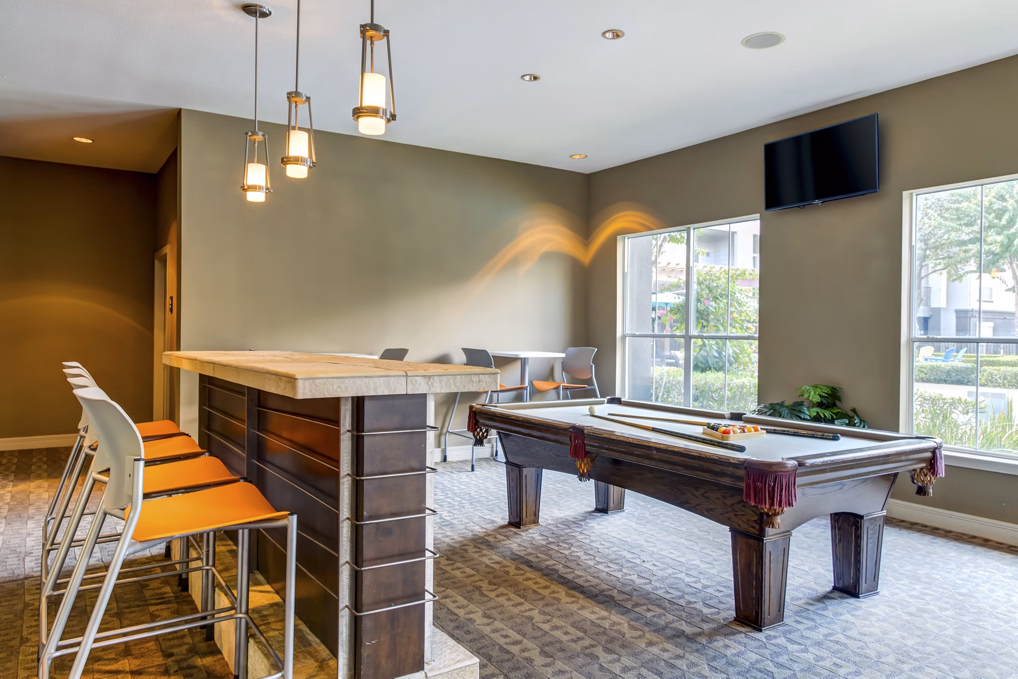 Clubhouse with modern design and comfortable seating at Estates at Memorial Heights Apartments