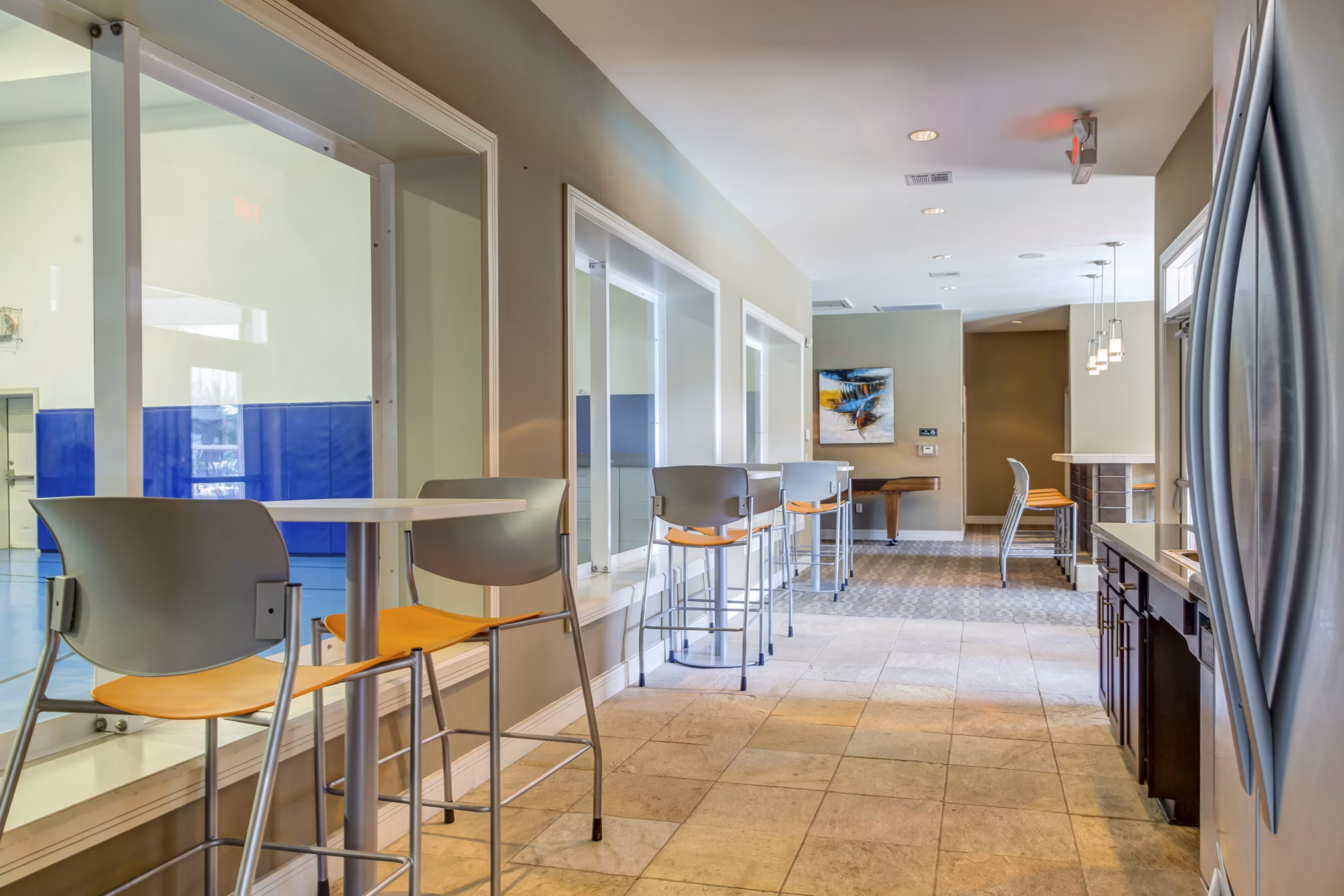 Clubhouse featuring stylish furnishings and spacious layout at Estates at Memorial Heights Apartments
