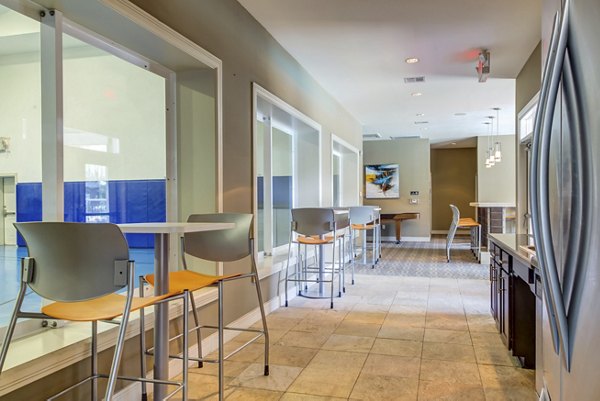 Clubhouse featuring stylish furnishings and spacious layout at Estates at Memorial Heights Apartments