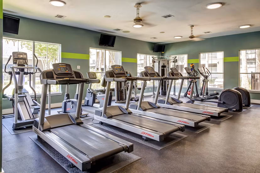 High-end fitness center with modern equipment at Estates at Memorial Heights Apartments, promoting active lifestyles for residents