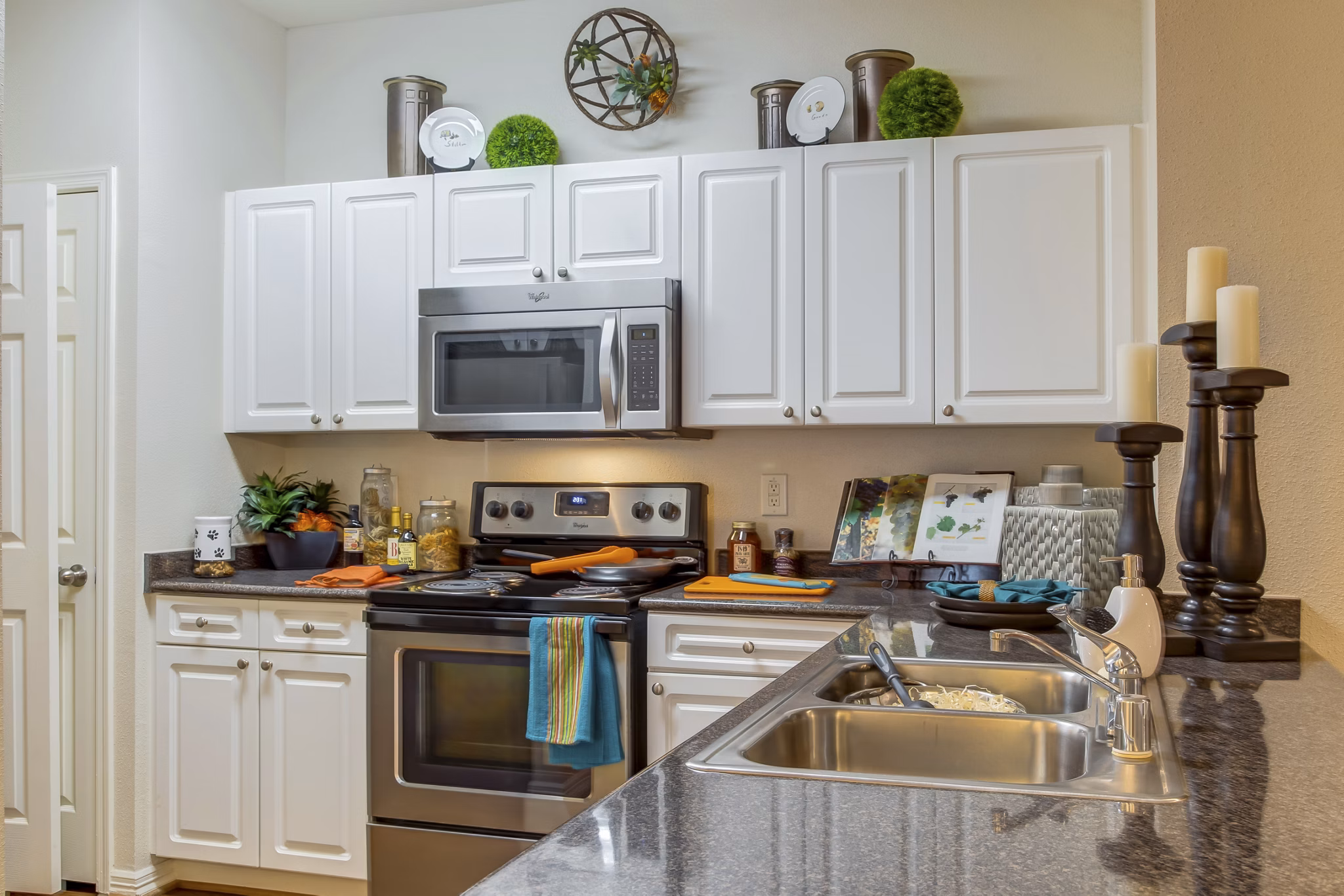 Modern kitchen with stainless steel appliances at Estates at Memorial Heights Apartments
