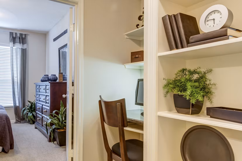 Living room featuring modern decor and ample natural light at Estates at Memorial Heights Apartments