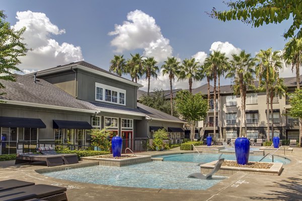 Luxurious pool with lounge chairs at Estates at Memorial Heights Apartments, ideal for relaxation and enjoyment
