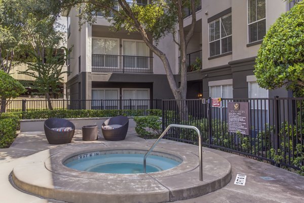 Hot tub at Estates at Memorial Heights Apartments with relaxing lounge chairs