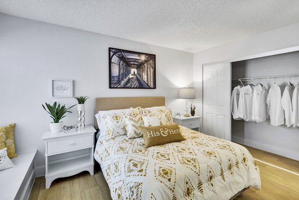 Spacious bedroom with modern furnishings at Montego Bay Apartments, offering comfort and style in a luxury setting