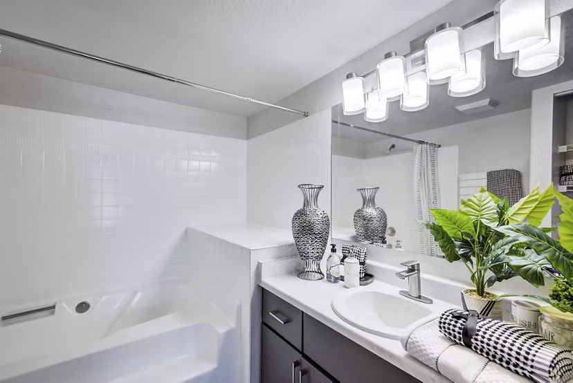 Luxurious bathroom with modern fixtures and elegant tile design at Montego Bay Apartments
