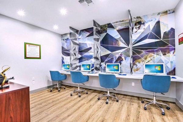 Modern business center with computer stations at Montego Bay Apartments