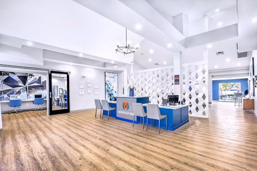 Montego Bay Apartments: Stylish clubhouse with modern seating and entertainment amenities