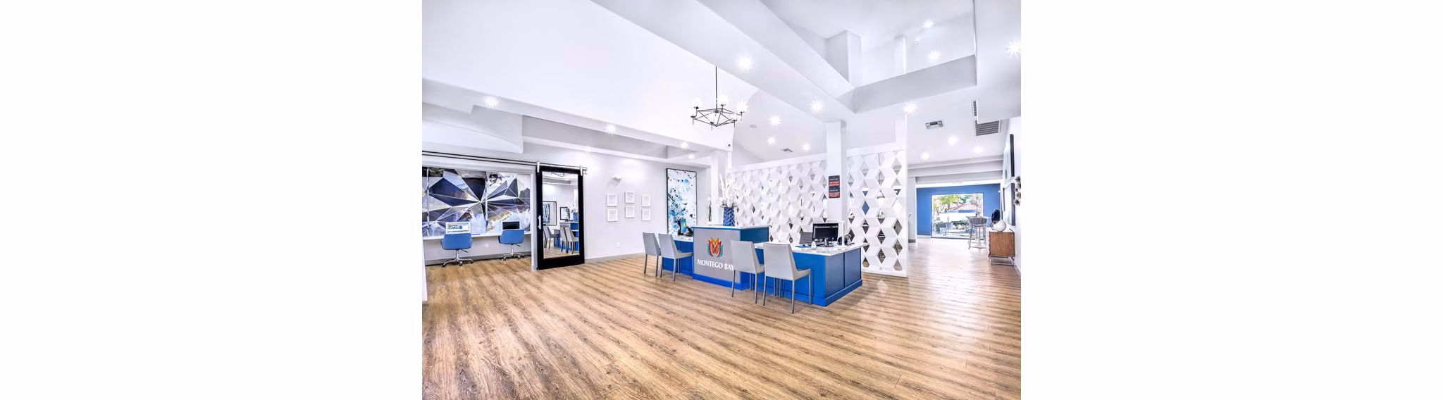 Montego Bay Apartments: Stylish clubhouse with modern seating and entertainment amenities