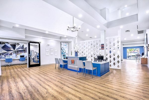 Montego Bay Apartments: Stylish clubhouse with modern seating and entertainment amenities
