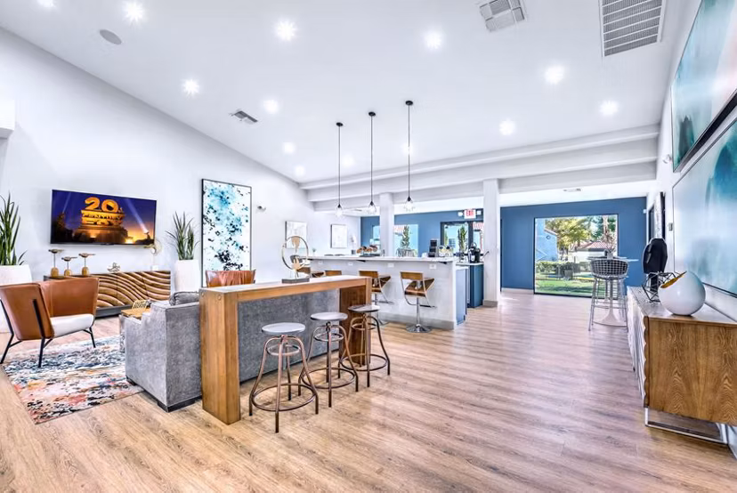 Elegant clubhouse with comfortable seating and modern design at Montego Bay Apartments, ideal for social gatherings and events