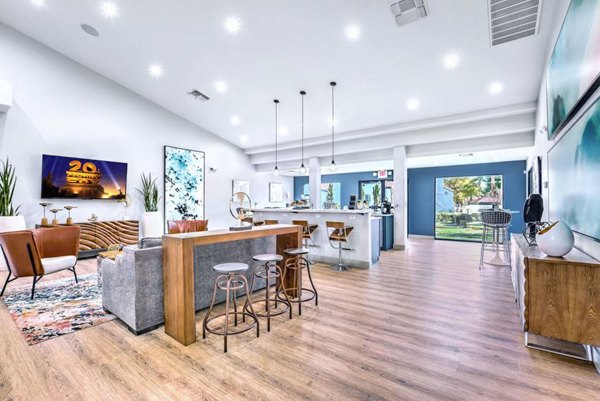 Elegant clubhouse with comfortable seating and modern design at Montego Bay Apartments, ideal for social gatherings and events