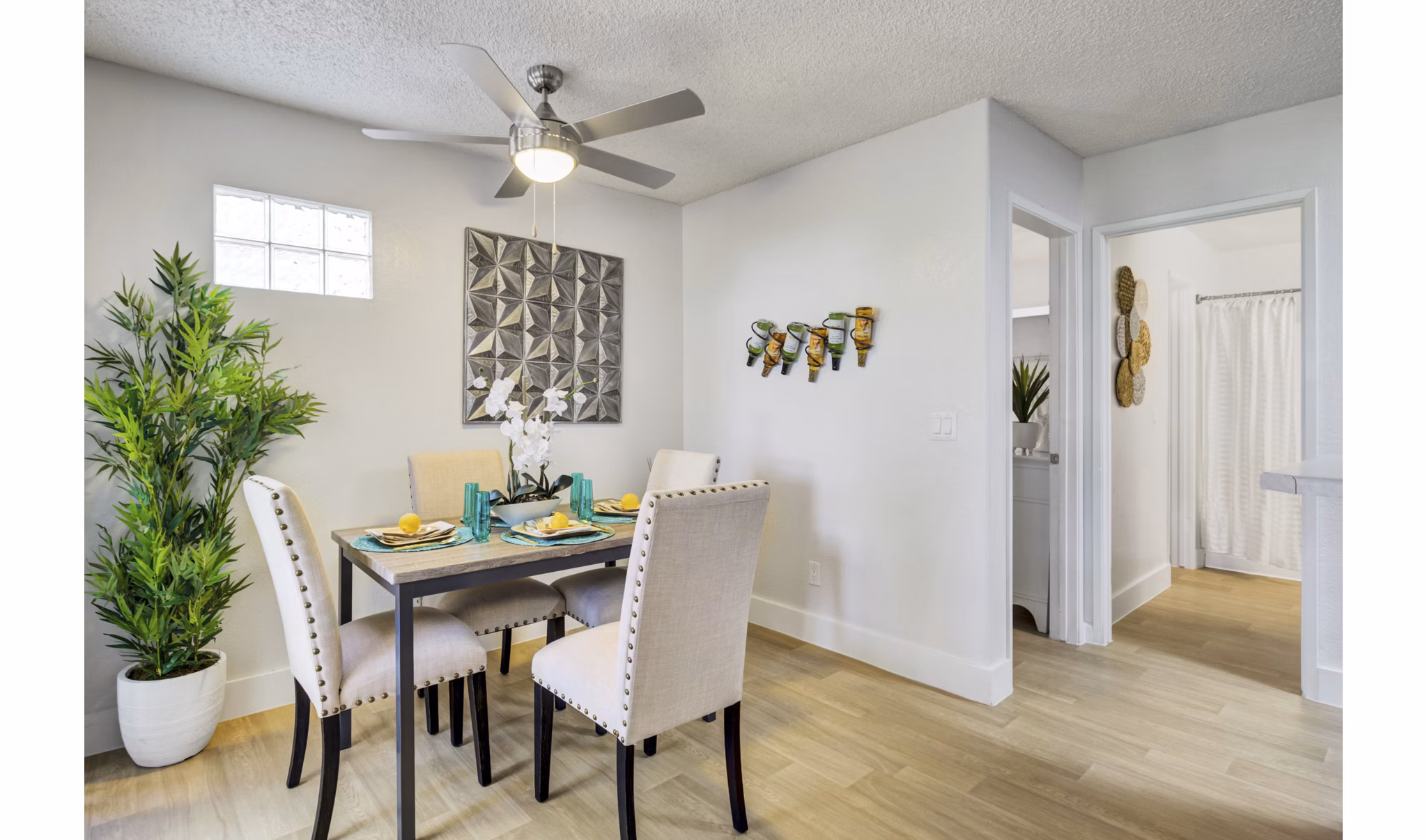 Dining area with modern furnishings at Montego Bay Apartments, featuring elegant decor and open layout