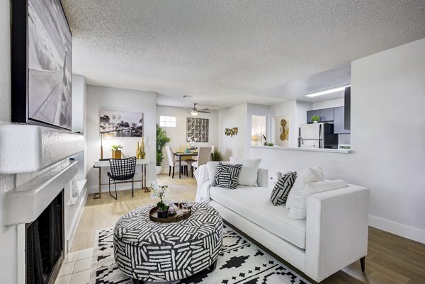 Living room at Montego Bay Apartments with modern decor and ample natural light, perfect for luxury living