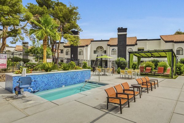 Resort-style pool with lush landscaping at Bay Court at Montego Bay Apartments