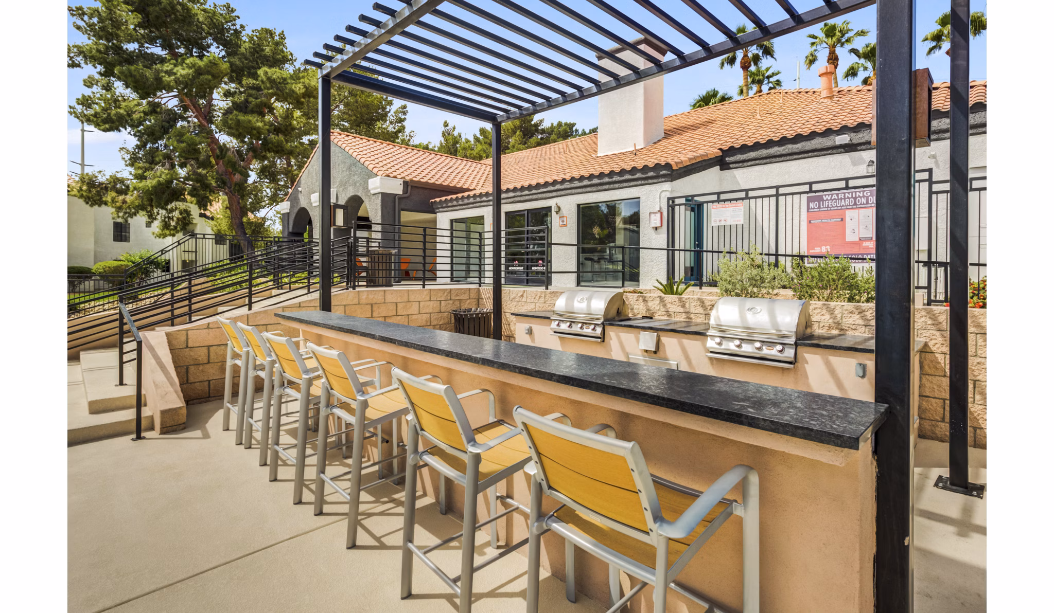 Outdoor grill area with modern appliances at Montego Bay Apartments, perfect for hosting gatherings and enjoying outdoor dining