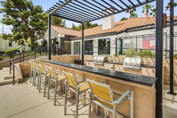 Outdoor grill area with modern appliances at Montego Bay Apartments, perfect for hosting gatherings and enjoying outdoor dining
