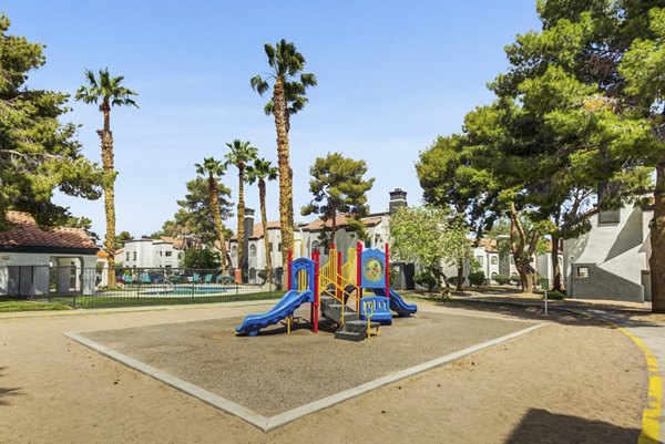 Family-friendly playground at Montego Bay Apartments featuring colorful play structures and open space for fun activities