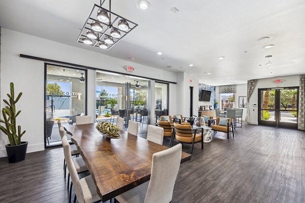 Clubhouse lobby featuring modern seating and lighting at Colton Apartments