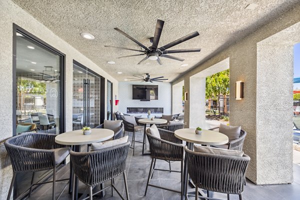 Spacious patio at Colton Apartments featuring outdoor seating and garden views