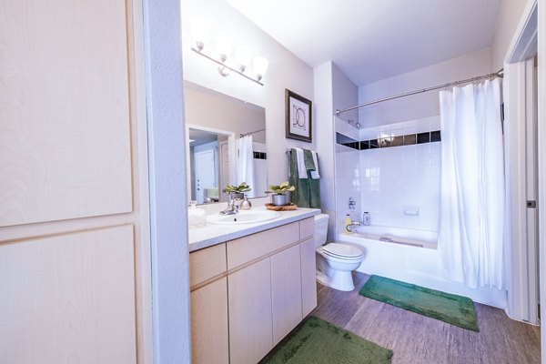 Modern bathroom featuring elegant fixtures and sleek design at Alanza Place Apartments