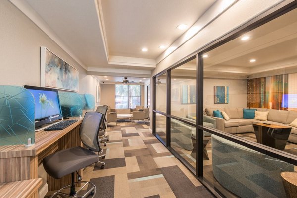 Home office featuring sleek desk and ergonomic chair at Alanza Place Apartments in Phoenix