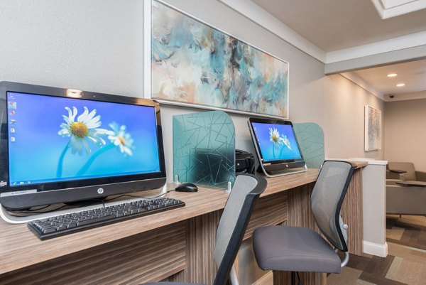 Home office with modern desk setup at Alanza Place Apartments
