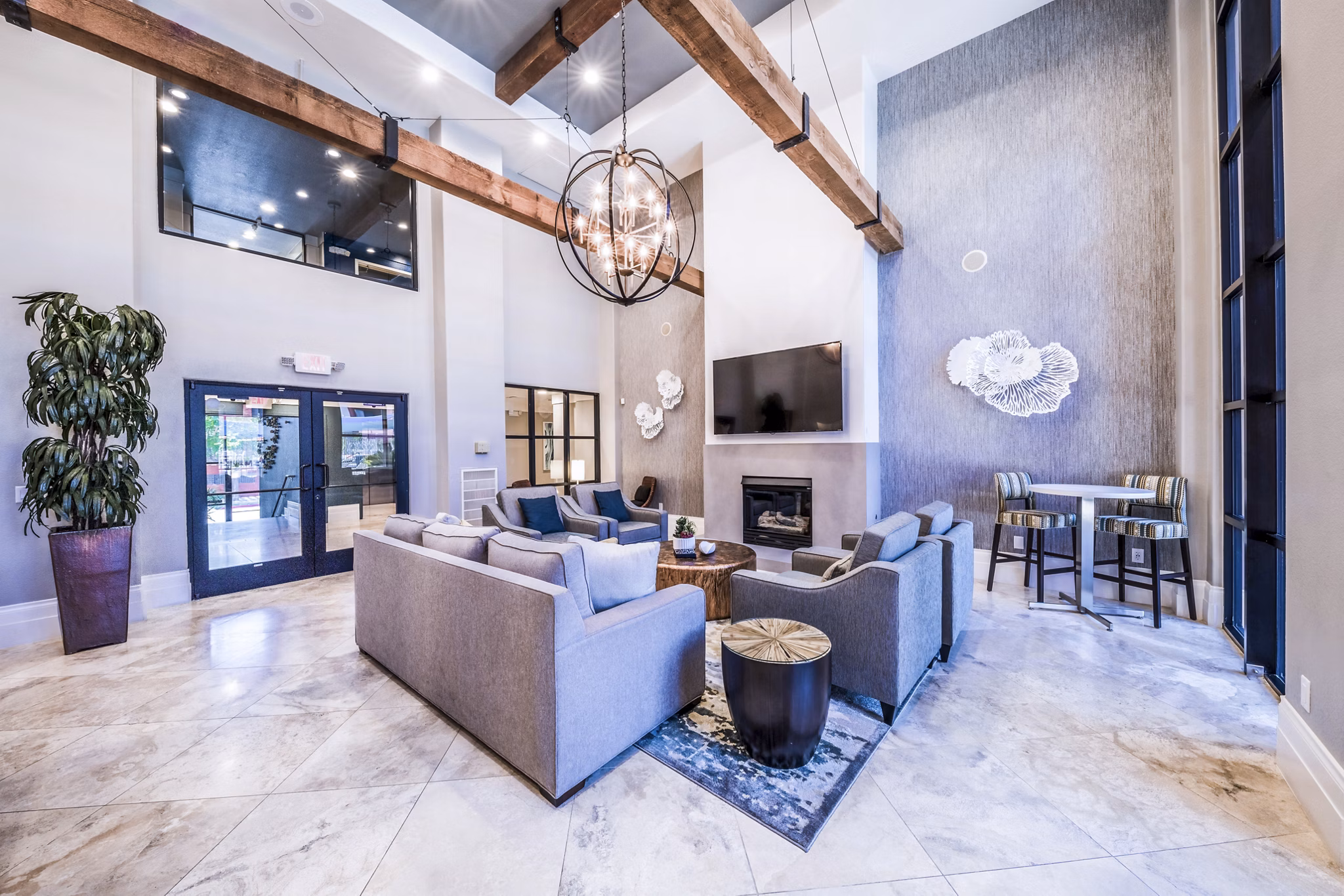 Alanza Place Apartments: Stylish clubhouse featuring modern decor and seating areas