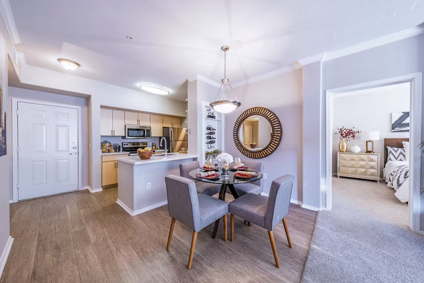 Dining room with elegant lighting and modern decor at Alanza Place Apartments