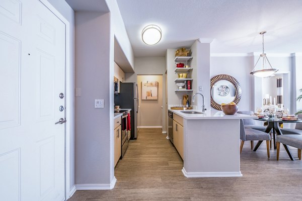 Modern kitchen with stainless steel appliances at Alanza Place Apartments