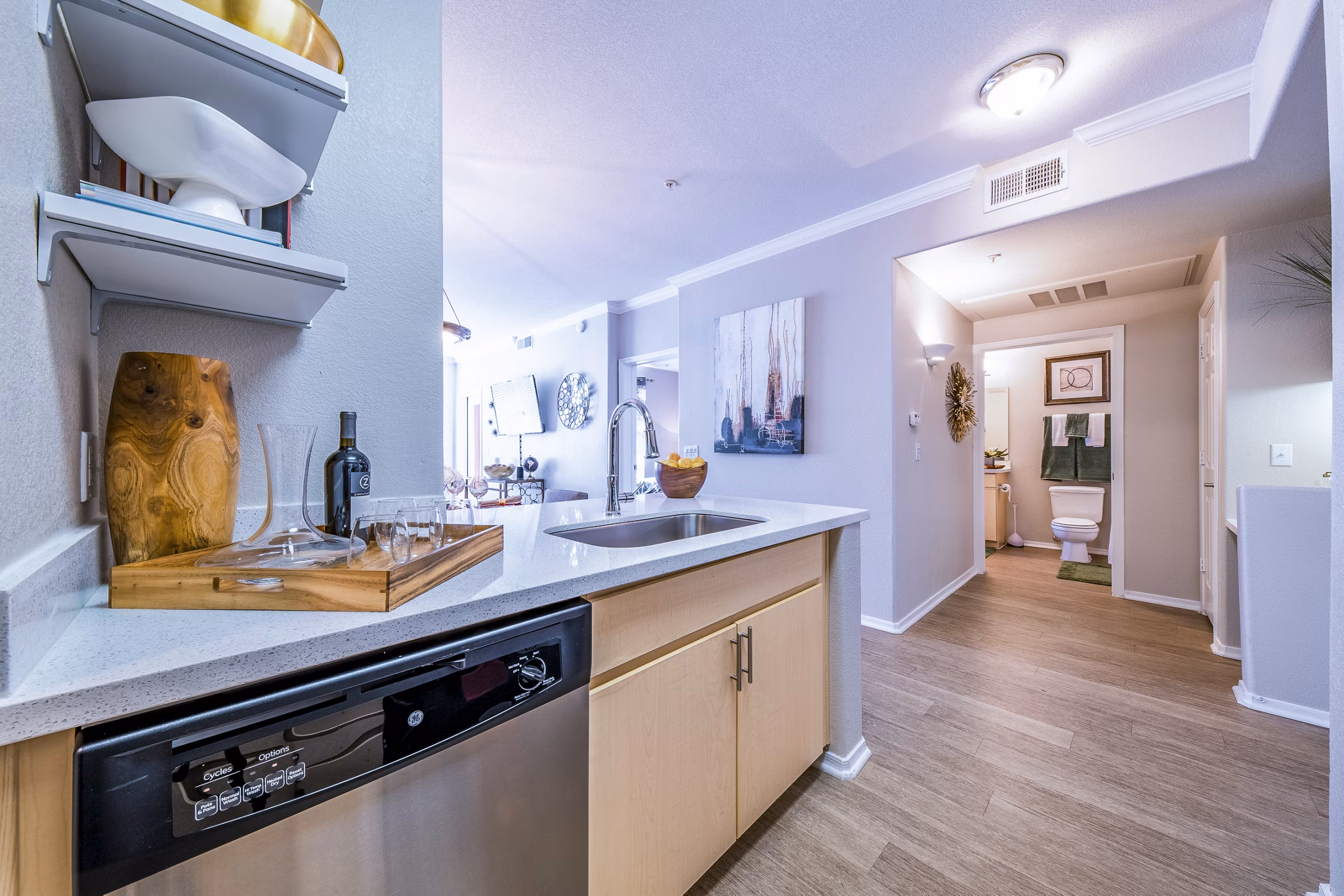 Modern kitchen with stainless steel appliances at Alanza Place Apartments