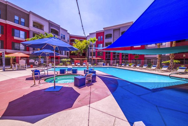 Resort-style pool with lounging areas at Alanza Place Apartments