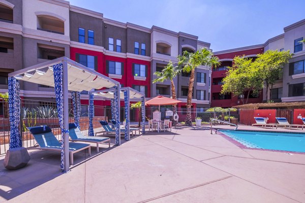 Resort-style pool with lounge chairs at Alanza Place Apartments, Phoenix's luxury residences