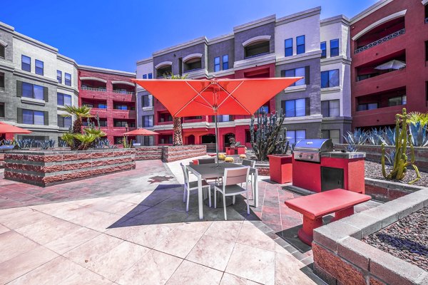 Spacious grill area with modern amenities at Alanza Place Apartments, perfect for outdoor cooking and gatherings