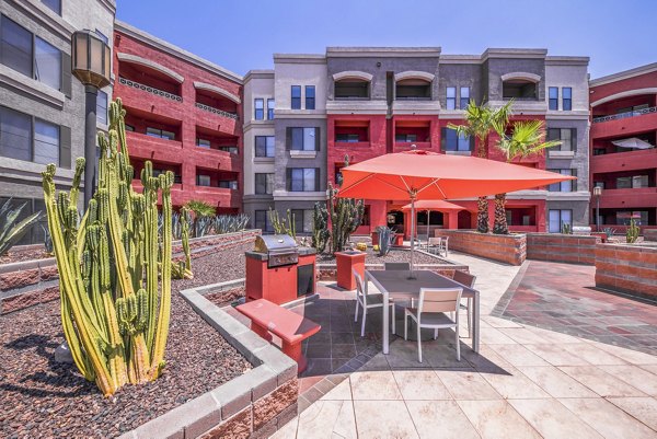 Grill area with modern seating at Alanza Place Apartments, perfect for outdoor dining and social gatherings