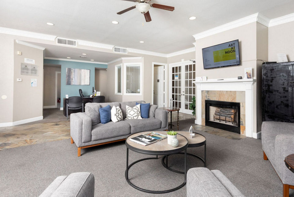 Clubhouse with modern decor and seating at Sendera at Greenway Apartments