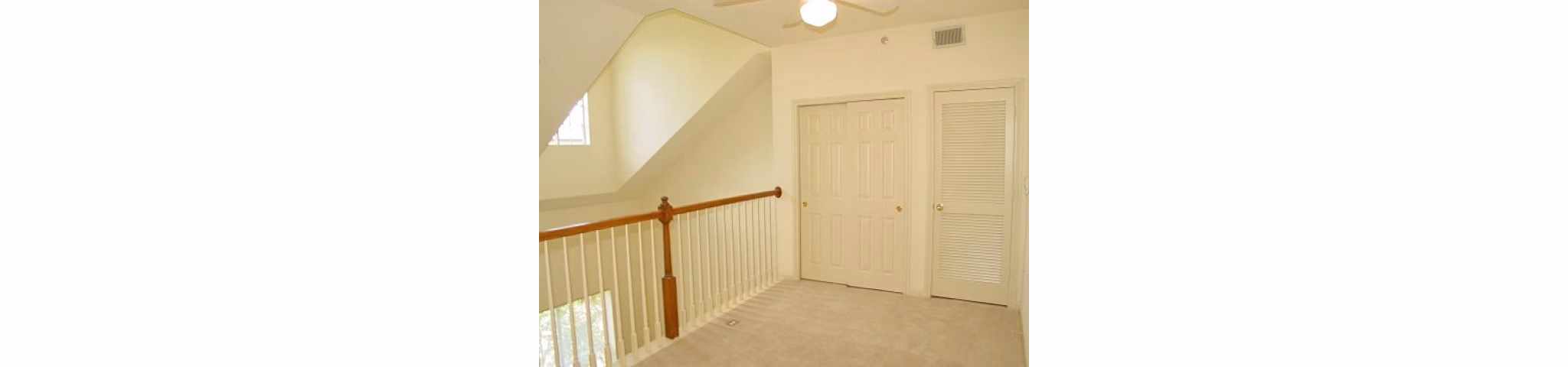 Elegant bedroom with modern decor and large windows at Plaza at River Oaks Apartments